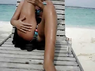 hot housewife pushing dildo at the sea coast